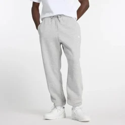 New Balance miesten collegehousut Sport Essentials Fleece Jogger Pants, vaaleanharmaa